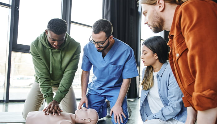 Group of people practicing CPR